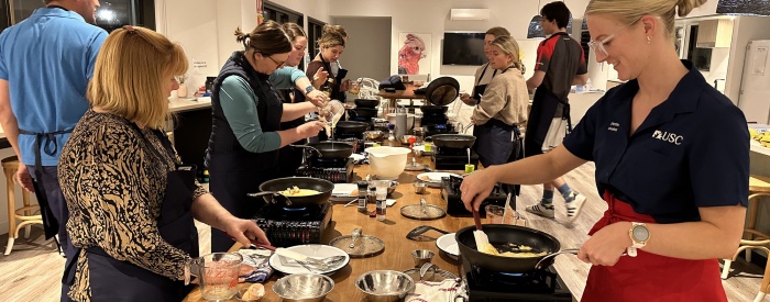 RIPPAH students participating in a free cooking workshop in their accommodation complex.